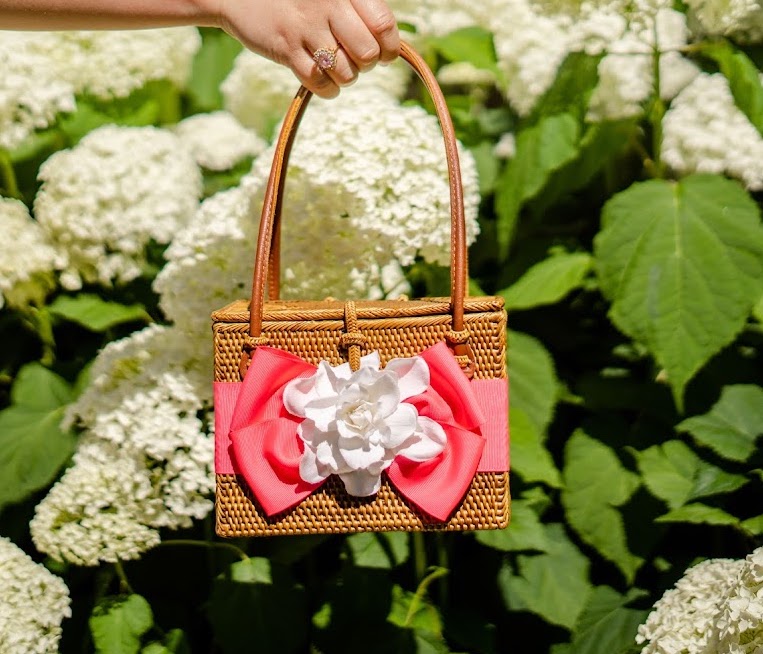 custom handwoven grass handbag with gardenia flower and large bow