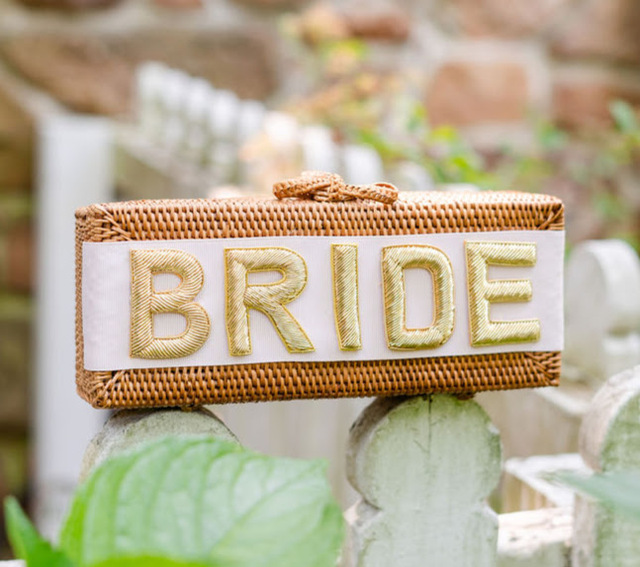 handmade straw clutch with bride embroidered on the side