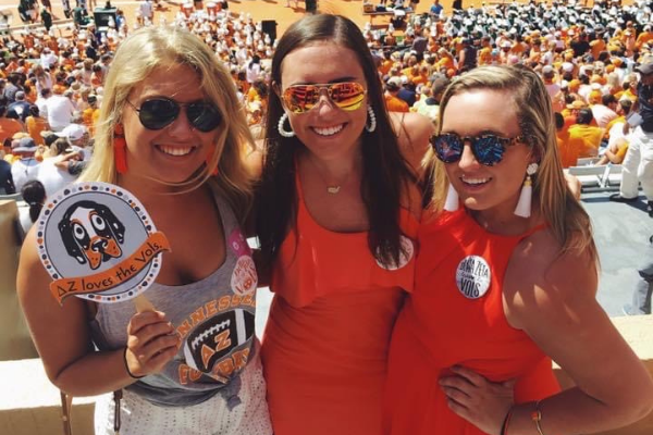 College besties at game day sporting their favorite Lisi Lerch earrings with pearls and tassels